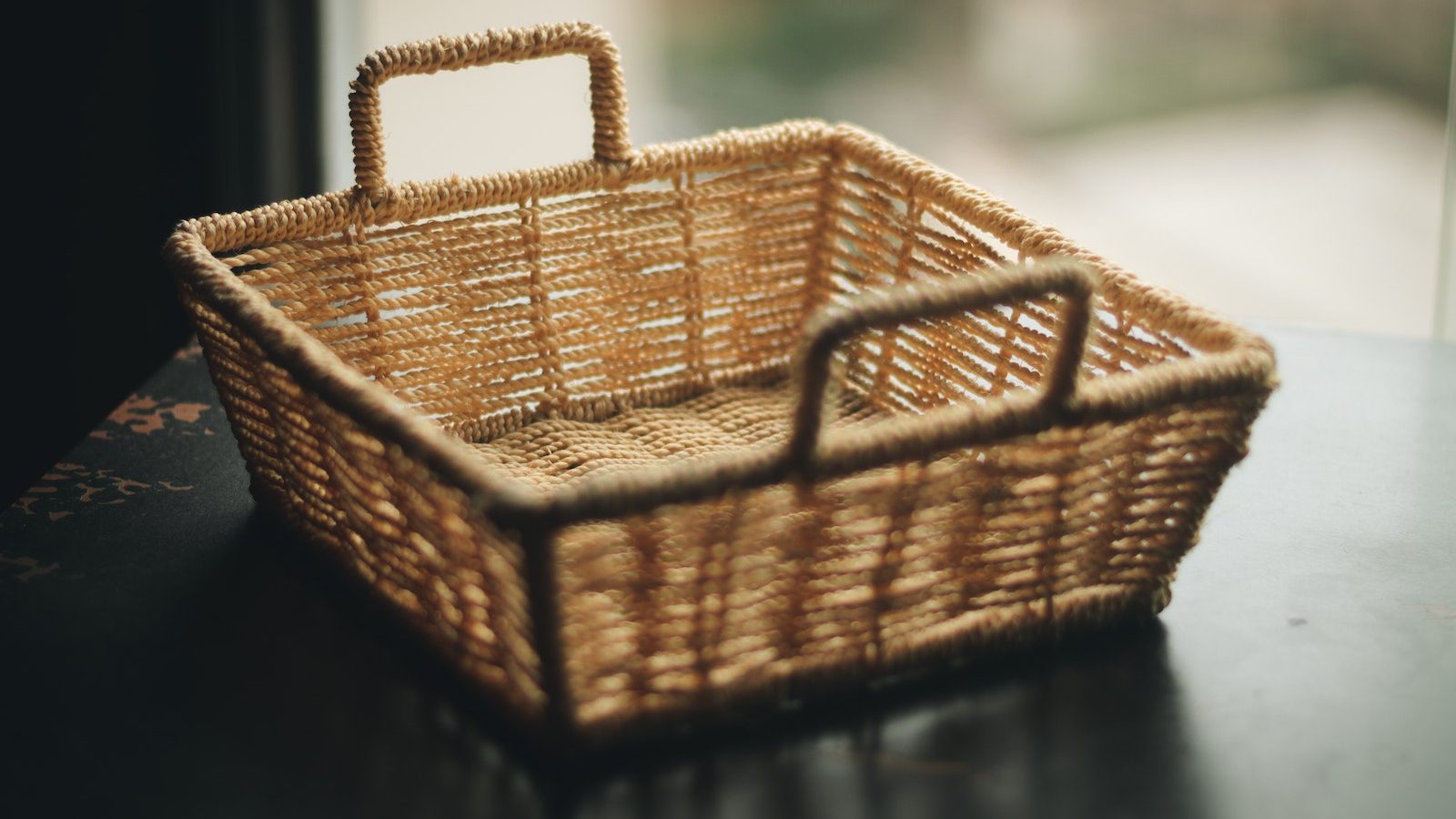 Square Brown Wicker Basket on Table